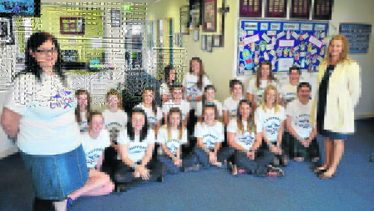 JOINING FORCES:  Anti-bullying campaigner Cassie Whitehill with St Catherine’s Catholic College, year nine students (back) Tara Barrington, Josie Southern, Tiia Renfrew, Chloe Gallegos,(behind)  Maddie Fawell, Abbey Hare, Chloe Ledger, Rachel Merrick, Jessie Frankham, Kate Perrin (front) Megan Purkiss, Lucy Smith, Jacinta Maher, Abby Caslick, Gabrielle Ernst, Rachael Sullivan, Emma Brooker-Hipwell and teacher Mandy Black.