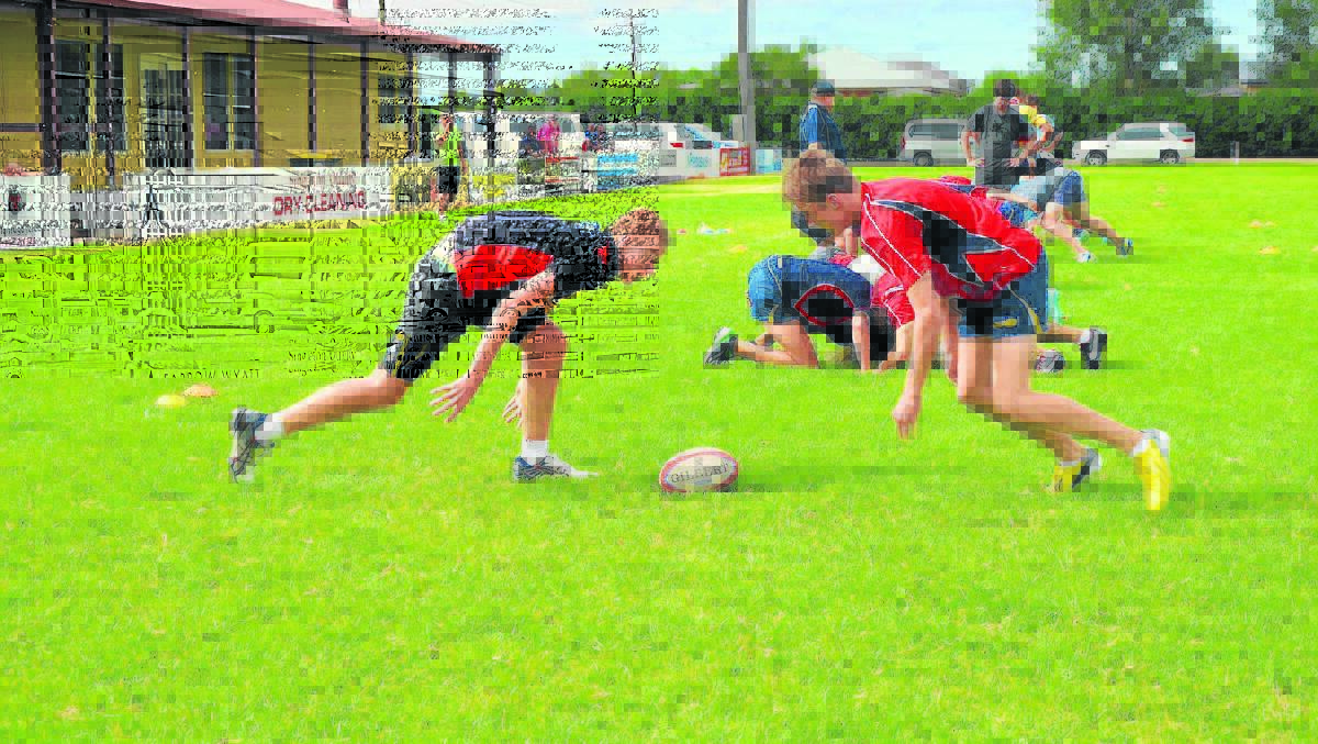  Hunter under 16s representative players Jackson Andrews (left)and Max Stafford  compete for the ball in a drill on Sunday