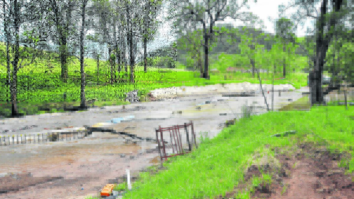 SOS: Residents at Goorangoola and Dawsons Hill were cut off from direct access to Singleton last week due to flooding at Double Crossing, Greenlands.