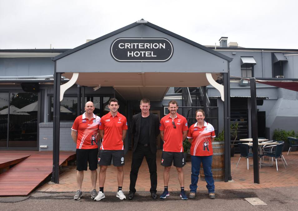 THE LOCAL PUB: The pair met with Singleton Roosters' officials Simon Trickey (junior president), Damian Silk (club sponsor - Criterion Hotel) and Nadine MacBride (senior president) this morning.