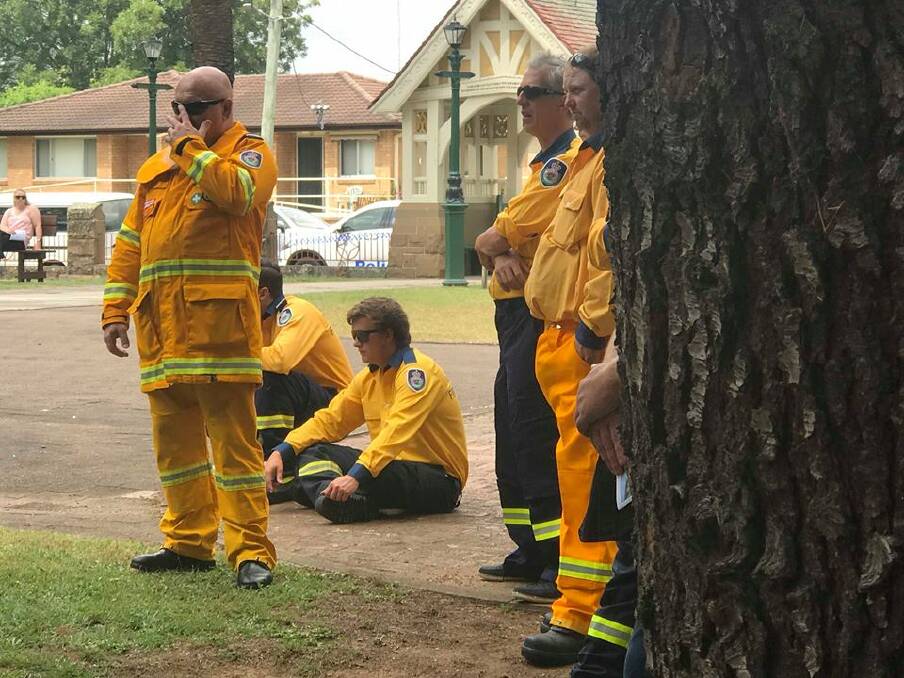 EMOTIONAL MORNING: An estimated 100 members of the NSW Rural Fire Service formed a guard of honour at the funeral service for Errol Smith this morning.