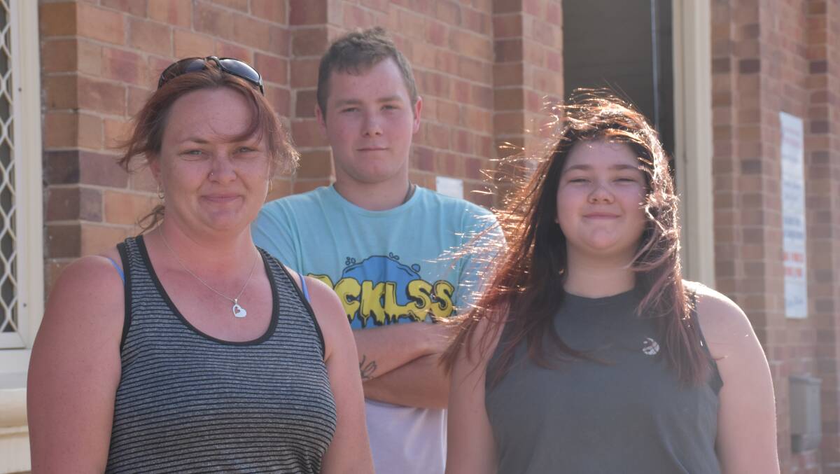 GOOD WILL: Alyssa Rose, Dylan Lyttle and Bridie Rose pictured moments after donating bottles of water to the Singleton Fire and Rescue 444 team on Tuesday.