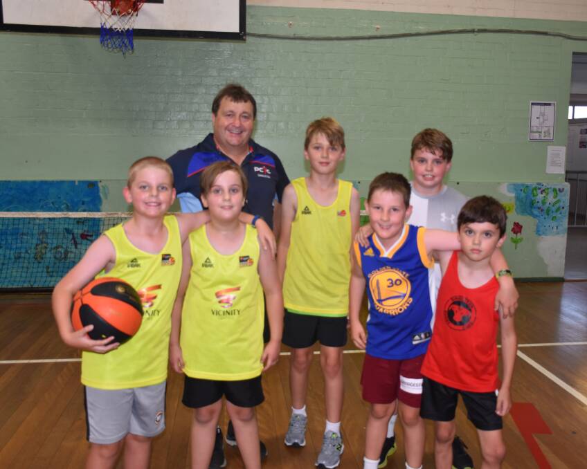 MASTER AND THE APPRENTICES: Singleton PCYC manager David Andrews is mentoring the next generation of basketballers this school term.