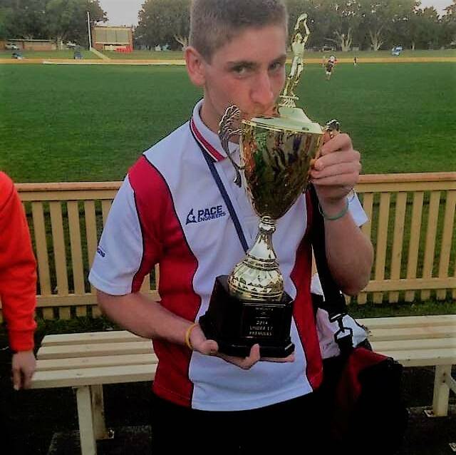 IN MEMORY: The late Bryan Childs celebrates his 2014 premiership.