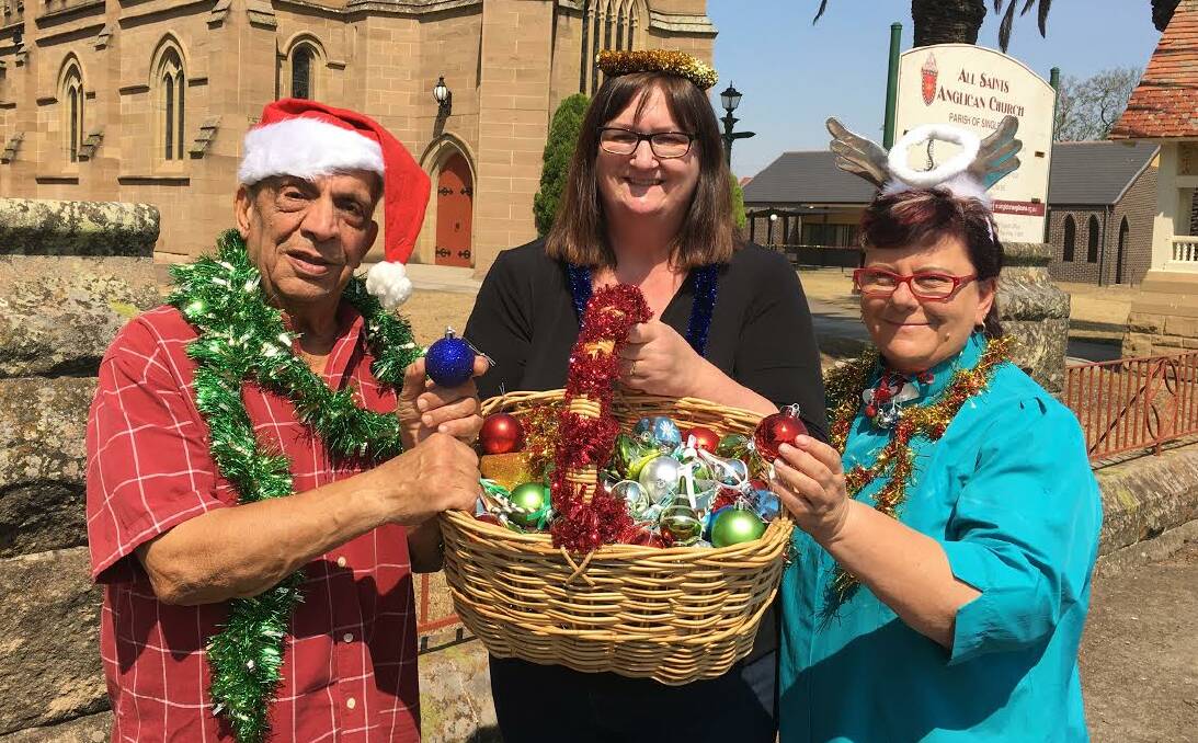 CHRISTMAS TIME: Volunteer Ted Jawhary, Parish Samaritans Link Wendy Love and Reverend Michelle Hazel-Jawhary ready to help decorate the Senior Citizens Centre.