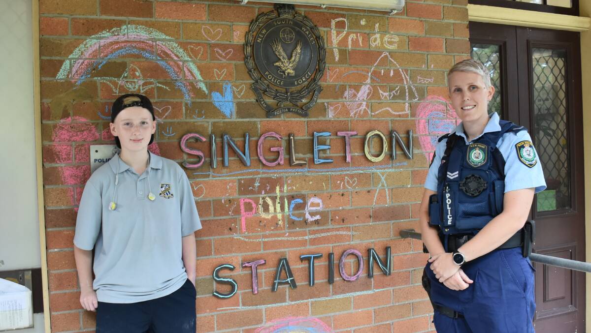 BRIGHTENED PERSPECTIVE: Year 9 student Zain Morris proudly stands with Senior Constable Sam Mellows (Singleton Police Station's GLLO).