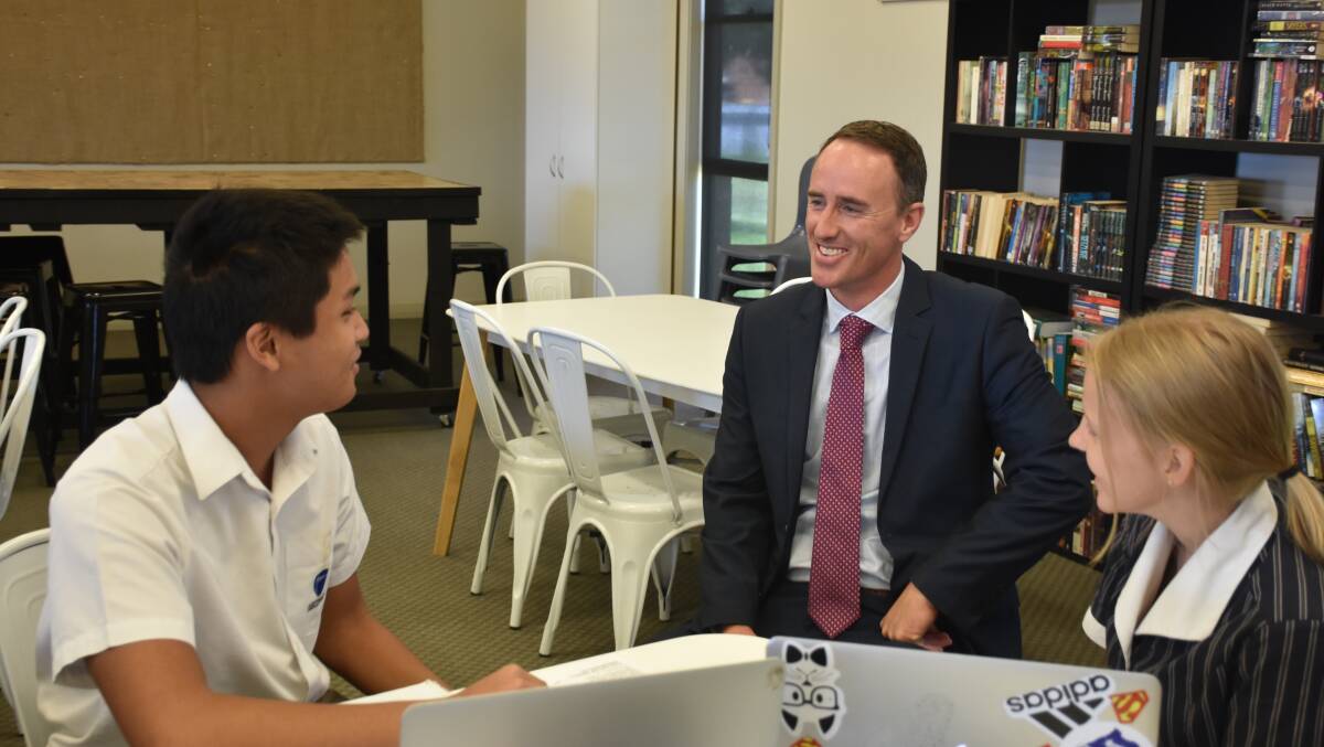 DISCUSSION TIME: Australian Christian College principal Tim Shields pictured with more of his Year 12 students.