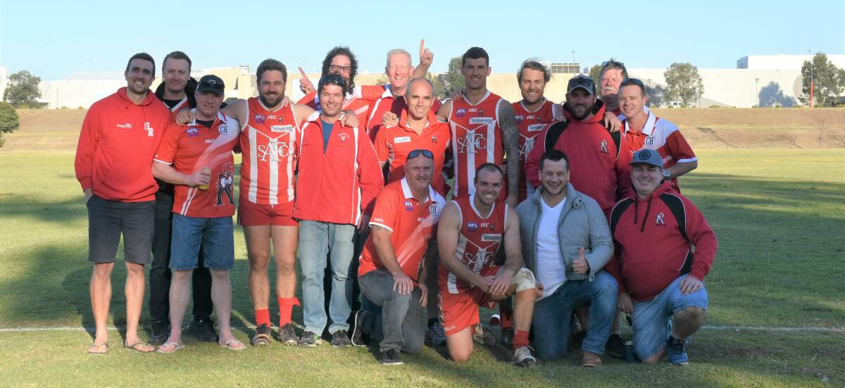 THE REUNION: Singleton Roosters past and present gathered for Old Boys Day this afternoon. Here the 2009 premiership team are pictured celebrating their 10-year reunion.