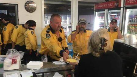 LIVE SCENES: Members from the Hunter Valley, Hawkesbury and Blue Mountains RFS brigades pictured at Grey Gum International Cafe.