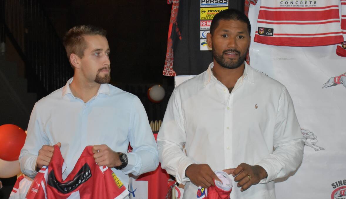 STAR DUO: Teenager James Bradley and 2013 NRL premiership player Frank-Paul Nu'uausala are presented with their jumpers.