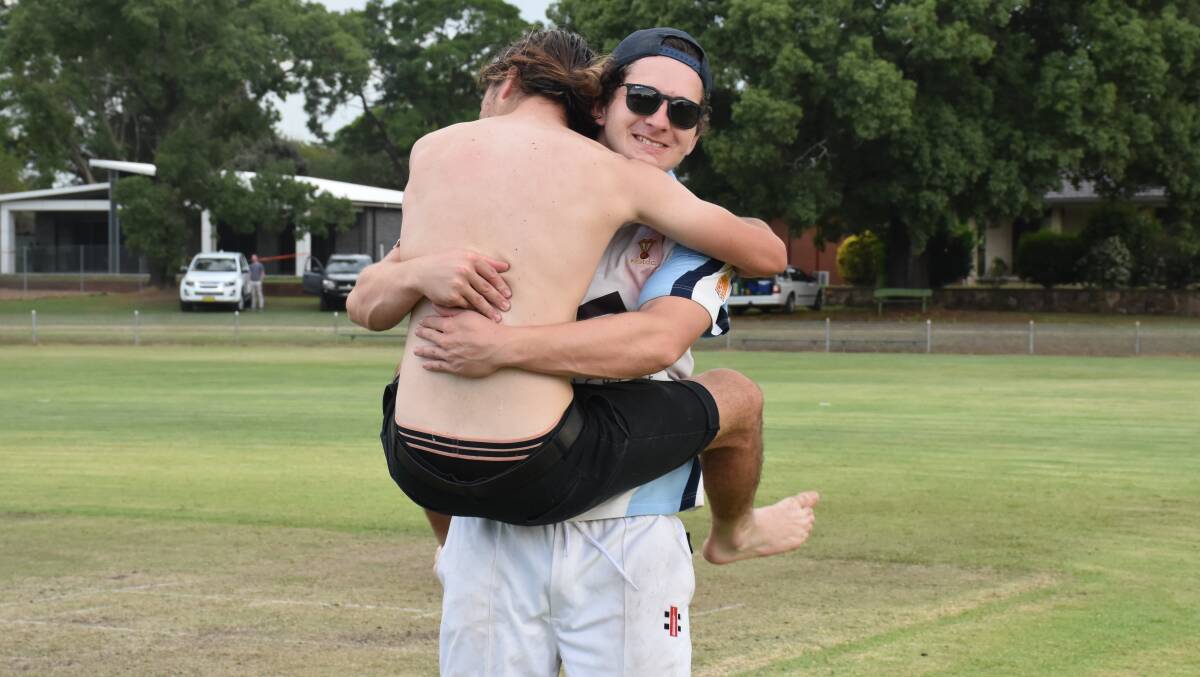 DROUGHT IS OVER: PCH teammates Jackson Cox and Jake Daniels celebrate last season's first grade premiership.