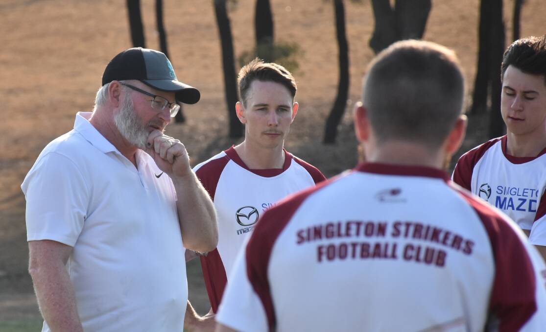 NEW FACE: Incoming Singleton Strikers first grade coach Brendan Slade pictured with his group on Tuesday afternoon.
