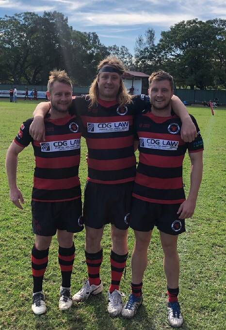 BROTHERLY BOND: Brothers Andrew, Simon and Samuel Walker pictured after their match against Southern Beaches last month. Back rower Simon, aged 30, made his first grade debut on the weekend.