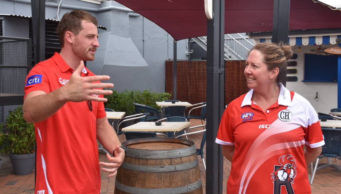 RED AND WHITE: Sydney Swan Harry Cunningham meeting with Singleton Roosters' senior president Nadene McBride at the Criterion Hotel.