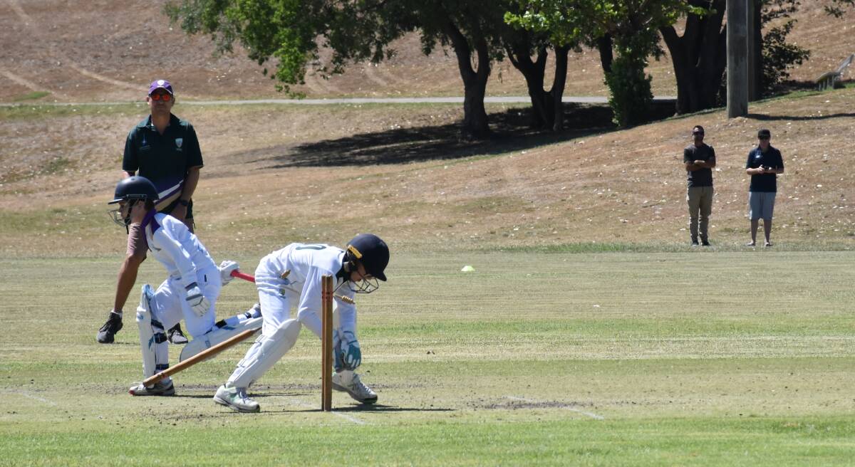 THE RUN OUT: The rivalry continued between Lake Macquarie and Newcastle on Sunday morning as the two under-12 sides faced off at Singleton's Cook Park 2.