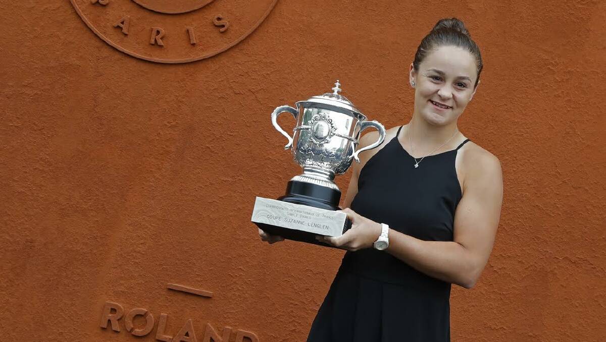 MAJOR WINNER: Australia's Ashleigh Barty poses with the trophy during a photo call at the Roland Garros stadium in Paris, Sunday, June 9, 2019. Barty won the French Open tennis tournament women's final on Saturday June 8, 2019. (AP Photo/Michel Euler) 