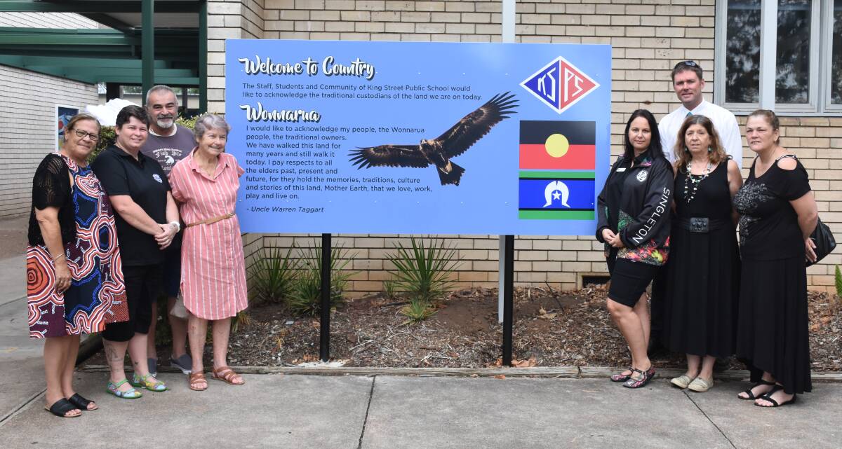 WELCOME TO COUNTRY: Pauline Mitchell, Kasey Hoare, Nick Mandas, Aunty Jill Mandas, Renee McDonald, Jonathan Russell (school principal), Aunty Deidre Heitmeyer and Anne McSweeney pictured before the new sign.