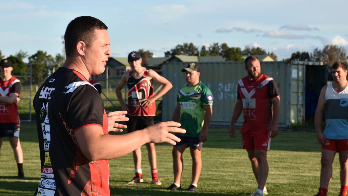 THE MENTOR: Jake Hawkins instructs his men at training earlier this month.