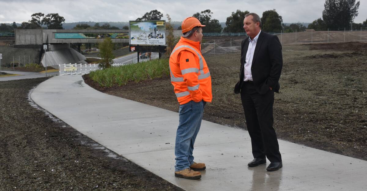 DISCUSSION TIME: Andrew Betts (ARTC's general manager for asset development) speaks to Michael Johnsen MP (Member for the Upper Hunter) at the opening of the Gowrie Gates on Thursday, July 4.