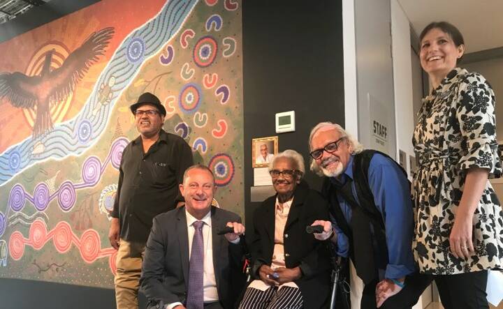 TRADITIONAL OWNERS: Michael Johnsen MP meets with the Miller family before the unveiled painting 'Aunty Kath's Connection to Country'. The extravagant piece is one of many stories associated with the Wonnarua people and, in particular, Aunty Kathleen Miller (pictured).