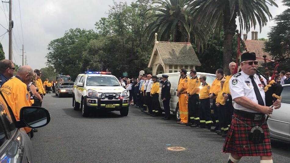 An estimated 100 members of the NSW Rural Fire Service formed a guard of honour at the funeral service for Errol Smith at the All Saints Church, Singleton, on Thursday January 10.