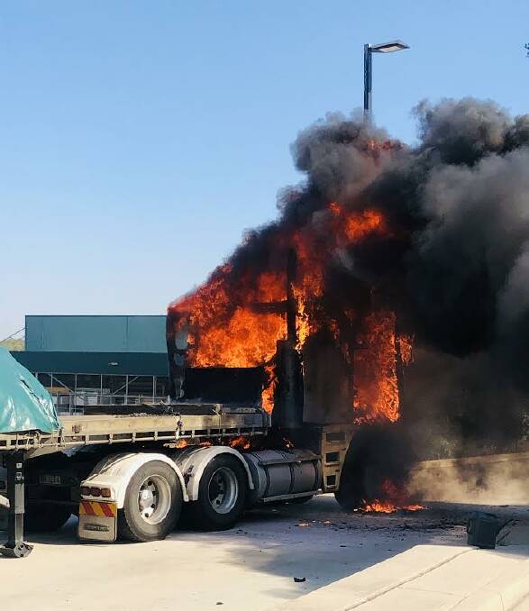 LIVE SCENES: A Tamworth bound Shameem's Haulage Pty Ltd truck caught fire at the McDougall's Hill Caltex service station (near Singleton) this morning. Driver Navonkar Singh quickly shifted his truck away from the station before he managed to escape the blaze.