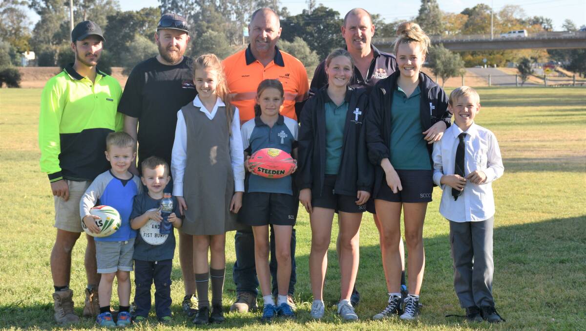 A TOUCH OF PARADISE: The sunny skies have greeted the region's touch football governing officials pictured with junior players.