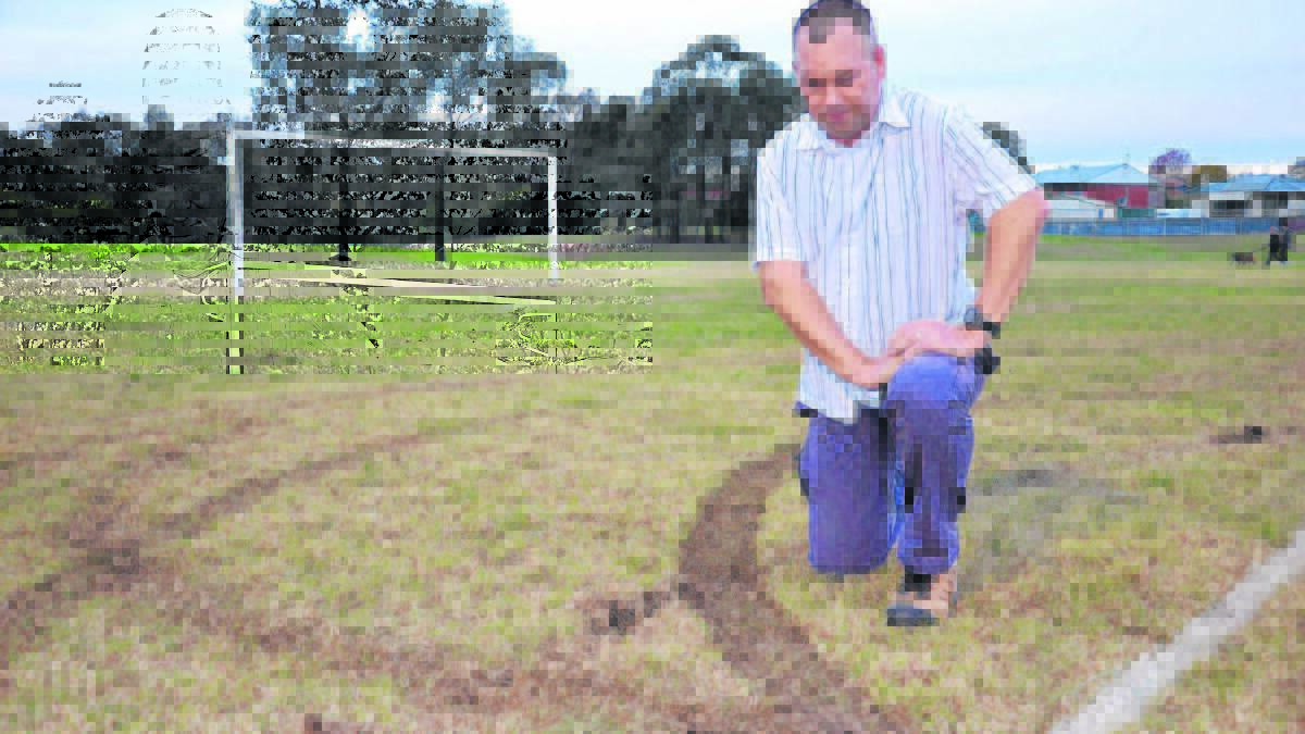 FLASHBACK: Mark Henderson pictured in May, 2015 the morning after Alroy Oval was vandalised by hoons.