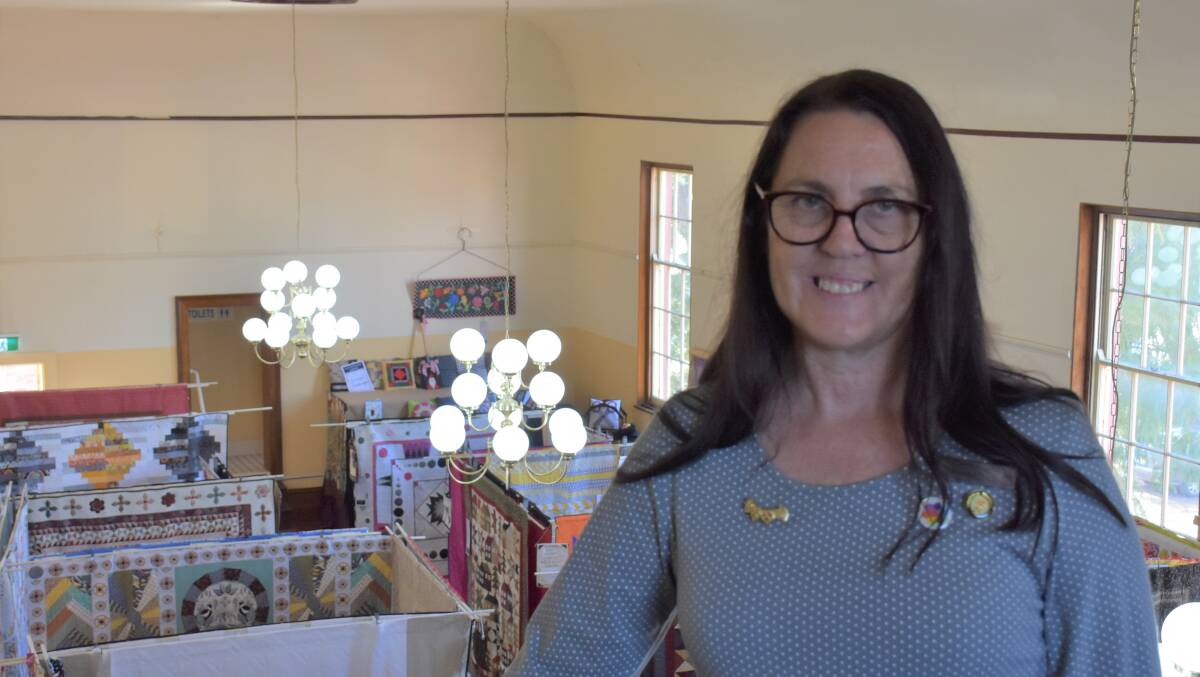 DOORS ARE OPEN: Singleton Quiltfest exhibition organiser Heather Anderson proudly dons her 35-year badge.