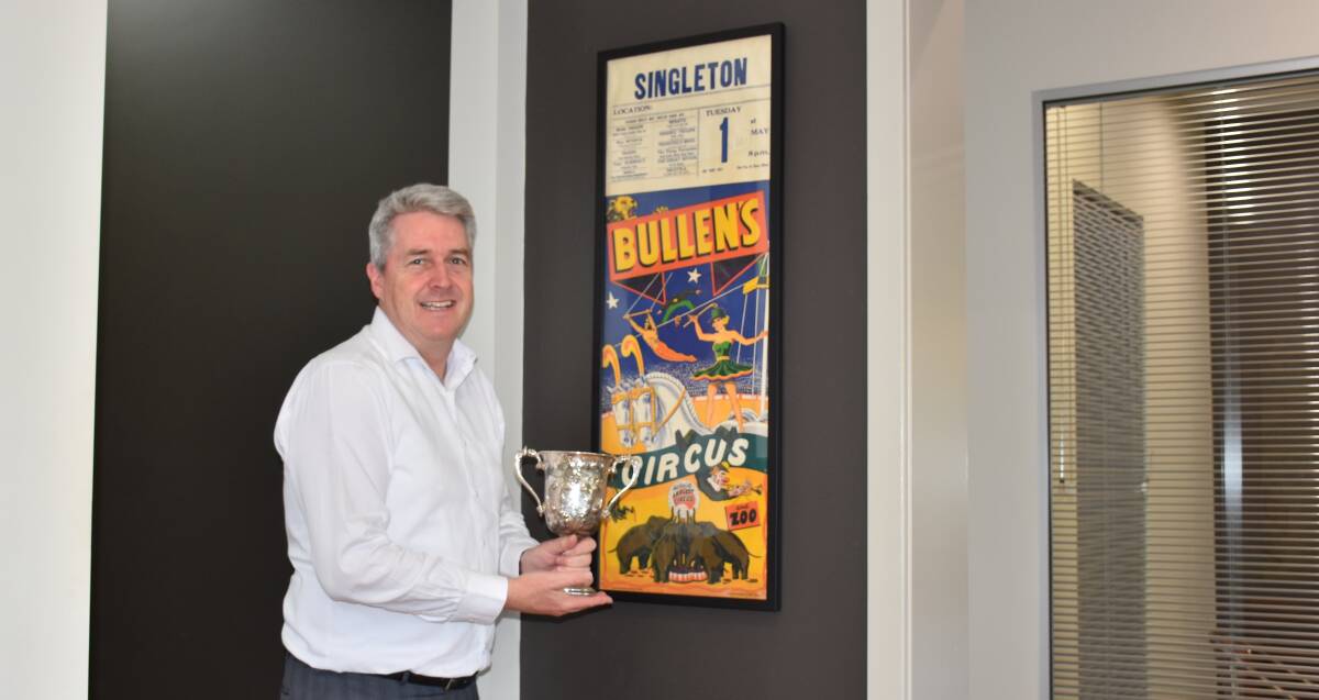 ANTIQUES: Peter Dunn holds the 1873 Singleton Show Poultry trophy, which he recently secured on an online auction, to add to his historic 1962 Singleton Circus poster.