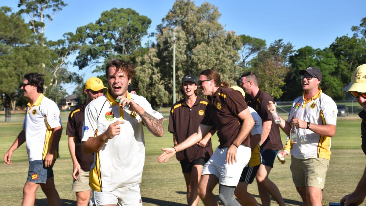 JUBILATION: Valley players march as one from Howe Park to the Singleton Golf Club for a night of celebrations.