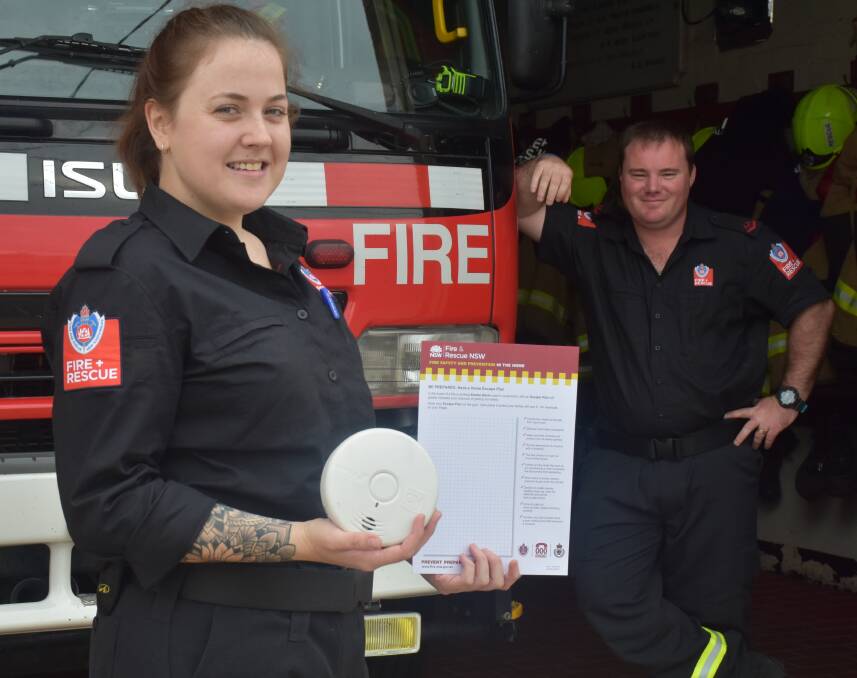 LEADING THE CHARGE: Singleton firefighter Megan Worth proudly presents a fire plan before her fellow Fire and Rescue members.