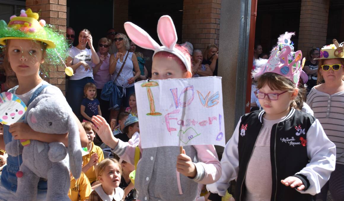 SIGNS OF A HAPPY EASTER: Students proudly march around the school's quadrangle to showcase their Easter themed attire.