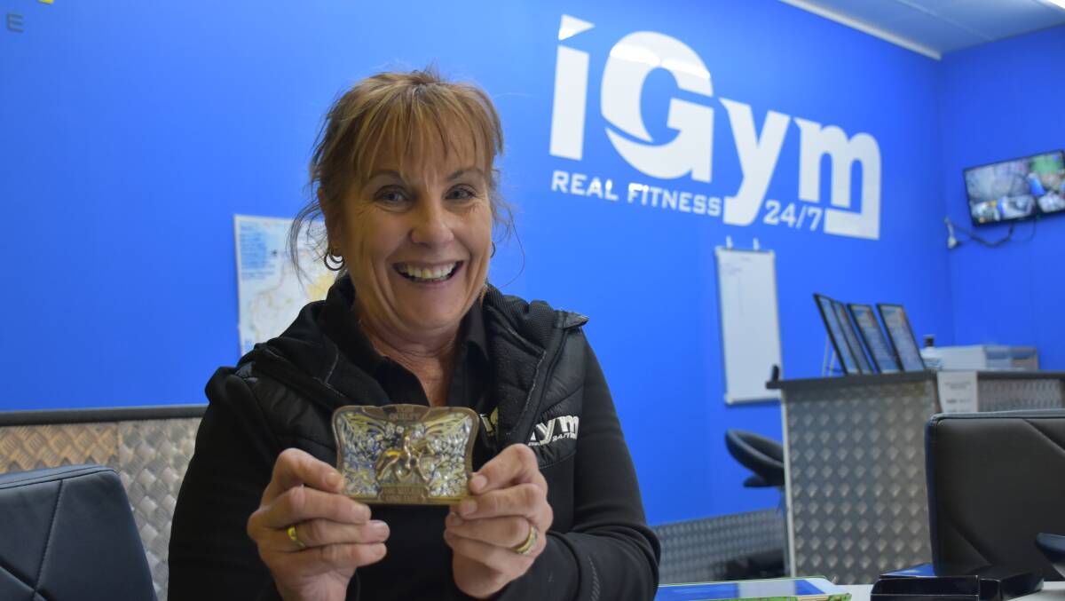 ALL SMILES: Debbie Pevy pictured while working at Singleton's iGym last month.
