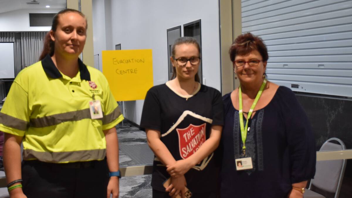 EVACUATION CENTRE: Emma Parrey (Salvation Army Emergency Services), Stephanie Lewis (Salvation Army volunteer) and Reverend Michelle Hazel-Jawhary (Samaritans Disaster Rescue volunteer) pictured at Singleton Heights this evening.