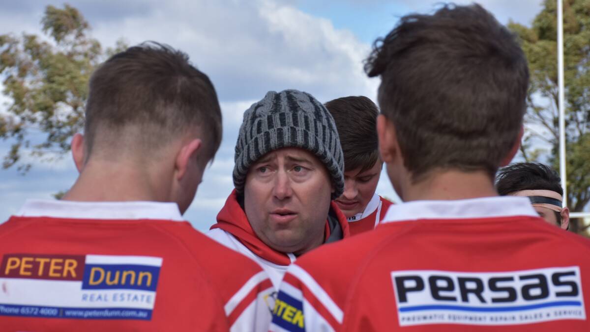 THE MASTERMIND: Dan Higgins addresses his side after their comfortable 28-0 victory on Saturday.