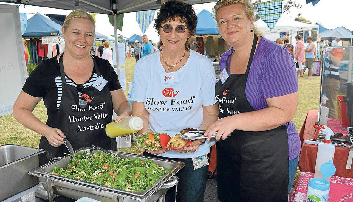 SLOW FOOD: Members of Slow Food Hunter Valley Eleanor Hutt, Miriam Farrington and Victoria Carroll  had a beautifully prepared salad available for visitors to Art Bazaar. 